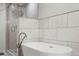 Bathroom featuring free-standing tub and shower with brushed nickel fixtures at 6145 S Perry Park Rd, Sedalia, CO 80135