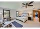 Bright and spacious bedroom with large windows and ceiling fan at 6145 S Perry Park Rd, Sedalia, CO 80135