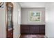 Welcoming entryway with custom built-in cabinets and views from the window at 6145 S Perry Park Rd, Sedalia, CO 80135