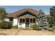 Charming home with a well-maintained lawn and a welcoming front porch, perfect for relaxing outdoors at 6145 S Perry Park Rd, Sedalia, CO 80135