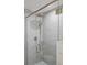 Luxurious shower with glass door, gray subway tile, and rain shower head at 6145 S Perry Park Rd, Sedalia, CO 80135