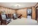 Upstairs landing with sitting area and natural wood accents at 6145 S Perry Park Rd, Sedalia, CO 80135