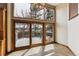 Dining area with large windows and sliding doors leading to the outdoor deck at 5797 S Laredo Ct, Centennial, CO 80015