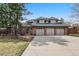 Lovely brick home with a three car garage and beautifully manicured lawn at 5797 S Laredo Ct, Centennial, CO 80015