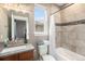 Elegant bathroom features a tile shower, modern vanity, and updated fixtures at 10145 Deerfield St, Firestone, CO 80504