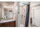 Beautiful bathroom featuring a tiled stand-up shower, sleek fixtures, and a stylish vanity at 10145 Deerfield St, Firestone, CO 80504