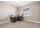 Spacious home office with large desk, chair, and natural light from the window at 10145 Deerfield St, Firestone, CO 80504