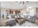 Bright and airy living room, seamlessly connected to the kitchen and dining areas at 10145 Deerfield St, Firestone, CO 80504