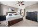 Spacious main bedroom with a ceiling fan, a black dresser, and a framed picture on the wall at 10145 Deerfield St, Firestone, CO 80504