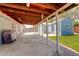 Covered patio with a grill, looking out at a shed and fenced backyard at 7291 Bryant St, Westminster, CO 80030