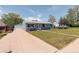 Charming single-story home with a well-manicured lawn, long driveway, and inviting curb appeal at 7291 Bryant St, Westminster, CO 80030