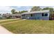 Exterior view of a charming home with a well-kept lawn, awning and inviting front entrance at 7291 Bryant St, Westminster, CO 80030