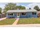 Attractive blue single-story home with well-manicured lawn at 7291 Bryant St, Westminster, CO 80030