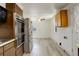 Bright kitchen featuring stainless steel appliances, wood cabinets, and light wood flooring at 7291 Bryant St, Westminster, CO 80030