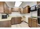 Retro kitchen with wood cabinets, white tile backsplash, and white countertops at 7291 Bryant St, Westminster, CO 80030