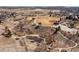 Aerial view of a park with baseball fields, winding trails, and natural landscape at 9810 Mulberry Way, Highlands Ranch, CO 80129