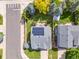 Aerial view of a home with solar panels on the roof and a well-maintained yard at 9810 Mulberry Way, Highlands Ranch, CO 80129