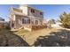 Lush backyard with a deck and grassy area for outdoor enjoyment at 9810 Mulberry Way, Highlands Ranch, CO 80129