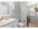 Bathroom and laundry room combination with decorative shelving and natural light at 9810 Mulberry Way, Highlands Ranch, CO 80129