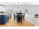 Eat-in kitchen with hardwood floors adjacent to the dining and living areas at 9810 Mulberry Way, Highlands Ranch, CO 80129
