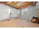 Unfinished basement awaits transformation, showcasing a window and exposed beams at 9810 Mulberry Way, Highlands Ranch, CO 80129