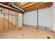 Large unfinished basement area with exposed beams and insulated walls, ready for remodeling at 9810 Mulberry Way, Highlands Ranch, CO 80129