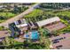 Aerial view of community pool, tennis courts, and clubhouse at 6431 Freeport Dr, Highlands Ranch, CO 80130