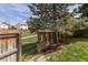 Backyard gate leading to a green space with a walking path at 6431 Freeport Dr, Highlands Ranch, CO 80130