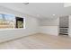 Finished basement with large window, built-in storage, and convenient access to the upper level at 6431 Freeport Dr, Highlands Ranch, CO 80130