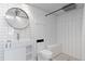 Modern bathroom featuring white subway tiles, stylish fixtures, and a sleek design at 6431 Freeport Dr, Highlands Ranch, CO 80130
