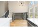 Open floorplan featuring an island, stainless appliances, vaulted ceilings and stairs to the second floor at 6431 Freeport Dr, Highlands Ranch, CO 80130