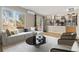 Stylish living room featuring hardwood floors, a modern sofa, and seamless connection to the kitchen at 6431 Freeport Dr, Highlands Ranch, CO 80130