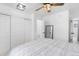 Comfortable bedroom featuring a cozy bed, spacious closet, and a stylish mirror, perfect for relaxation and storage at 12606 Fairfax St, Thornton, CO 80241