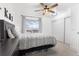 Bright bedroom featuring a comfortable bed, ample closet space, and natural light, creating a cozy and inviting atmosphere at 12606 Fairfax St, Thornton, CO 80241