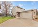 Charming home featuring a two-car garage, landscaped front yard, and inviting exterior at 12606 Fairfax St, Thornton, CO 80241