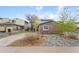 Home featuring a brick facade, driveway, and low-maintenance rock landscaping at 12606 Fairfax St, Thornton, CO 80241