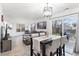 Bright living room with modern decor, comfortable seating, and a dining area for entertaining and relaxation at 12606 Fairfax St, Thornton, CO 80241