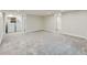 Large basement area with carpet flooring, open doorway to a laundry room and a full bathroom at 1351 Brentwood St, Lakewood, CO 80214