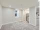 Bright basement bedroom with closet, window, and plush carpet at 1351 Brentwood St, Lakewood, CO 80214