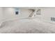 Spacious finished basement with plush carpet and a staircase leading to the upper level at 1351 Brentwood St, Lakewood, CO 80214