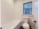 Bright bathroom featuring a bathtub and classic fixtures, with a clean and functional design at 1351 Brentwood St, Lakewood, CO 80214