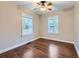 Bedroom featuring hardwood floors, natural light, and neutral tones, offering a versatile space at 1351 Brentwood St, Lakewood, CO 80214