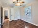 Well-lit bedroom with hardwood floors and ample closet space at 1351 Brentwood St, Lakewood, CO 80214