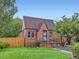 Charming brick home features a manicured lawn and a classic, welcoming facade at 1351 Brentwood St, Lakewood, CO 80214