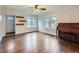 Bright living room features hardwood floors, decorative shelves, and ample natural light at 1351 Brentwood St, Lakewood, CO 80214