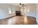 Inviting living room boasts hardwood floors and seamlessly connects to other areas of the home at 1351 Brentwood St, Lakewood, CO 80214