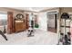 This finished basement features large windows, an elliptical, and a multi-station home gym system at 5271 N Mesa Dr, Castle Rock, CO 80108