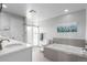Bright bathroom features a shower, bathtub and white vanity at 5271 N Mesa Dr, Castle Rock, CO 80108