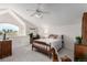 Cozy bedroom with a ceiling fan, large window with views, and comfortable decor at 5271 N Mesa Dr, Castle Rock, CO 80108