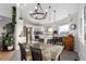 Modern kitchen with stainless steel appliances, island seating, and an adjacent dining area perfect for Gathering meals at 5271 N Mesa Dr, Castle Rock, CO 80108
